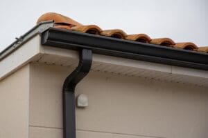black gutters and downspouts