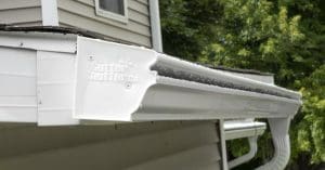 Close up view of a white Gutter Shutter gutter system.