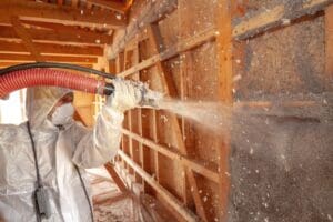 spraying cellulose insulation